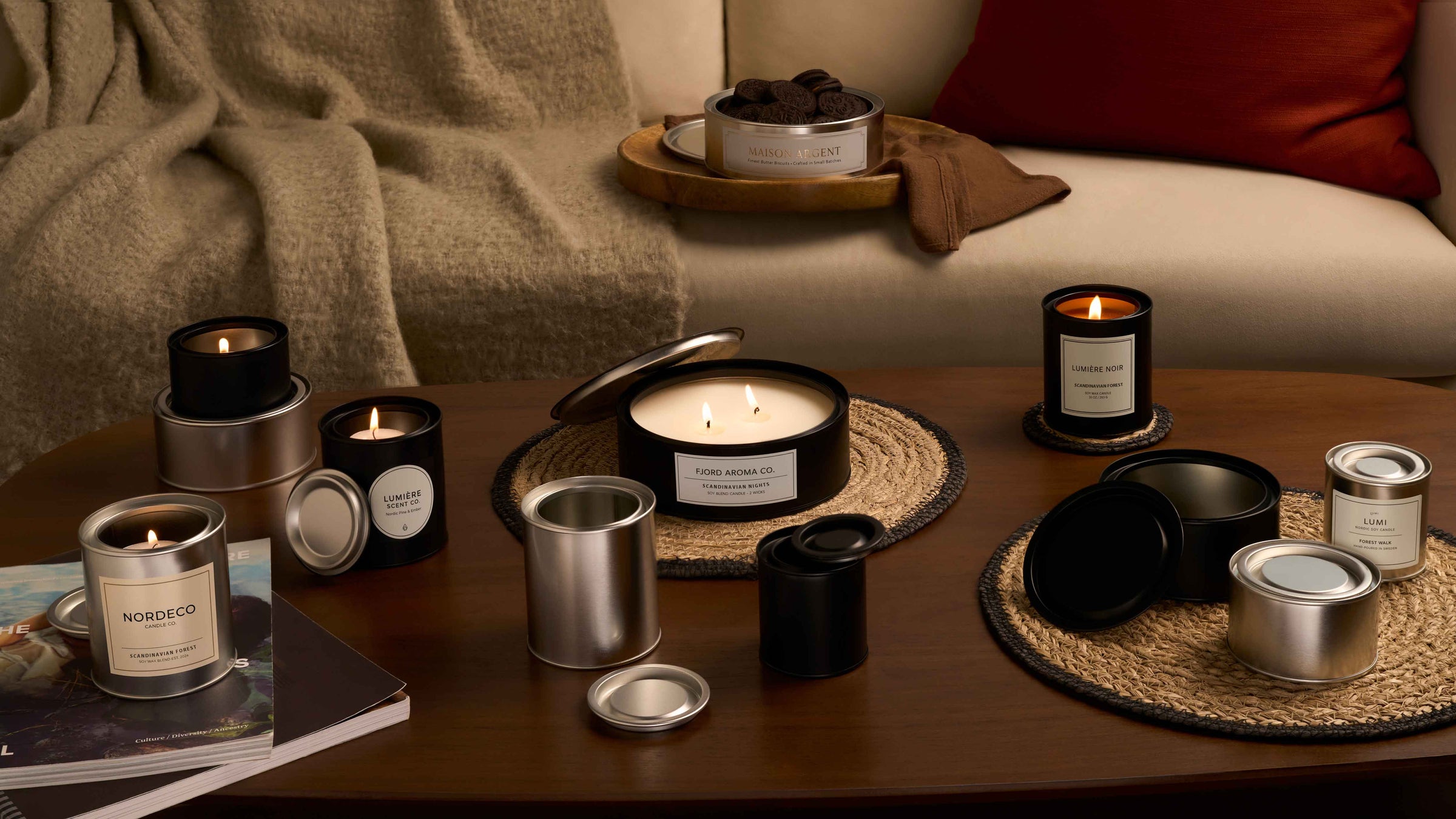 Lever lid tins with candles in living room. 
